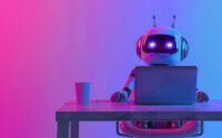 Robot working on a laptop, representing building a website with AI